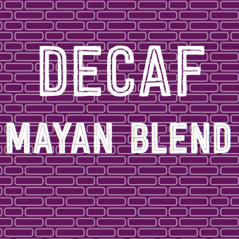 Decaf Mayan Blend coffee bag with purple brick background, featuring water processed, silver medal winner.