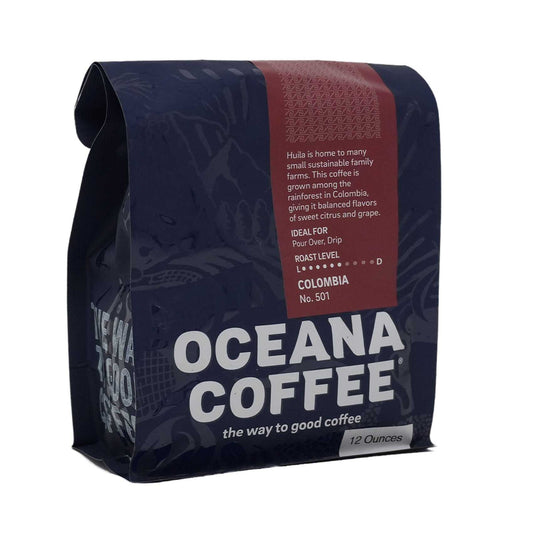 Colombia - Planadas coffee bag with rich flavor notes of orange, caramel, and cherry.