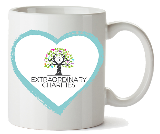 White coffee mug with a blue heart and Extraordinary Charities logo featuring a colorful tree and text