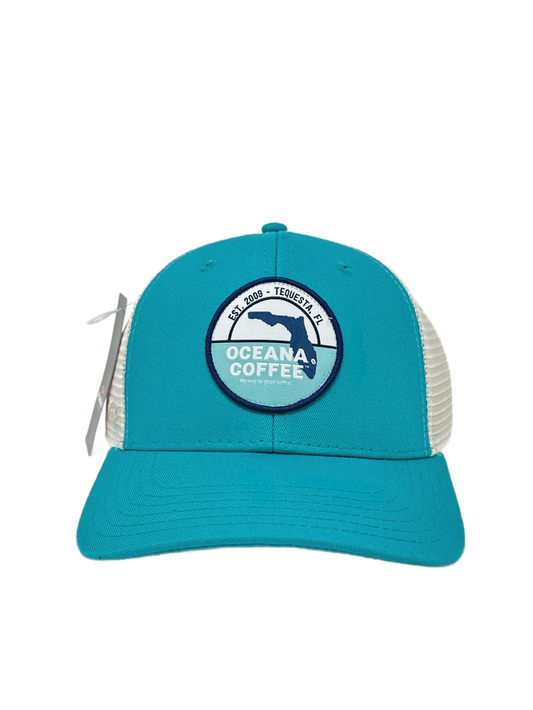 Oceana Coffee Trucker Hat in teal with logo.