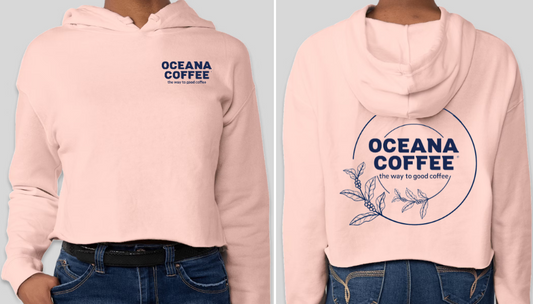Oceana Coffee Hoodie in blush pink with logo on front and back.