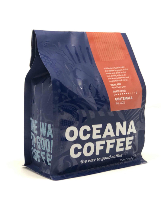 Guatemala Huehuetenango medium roast coffee with tangerine, chocolate, and walnut notes, Rainforest Alliance Certified, from specialty highland producers.